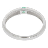 Sterling silver ring showcasing a round green emerald accent, highlighting elegance and sophistication.